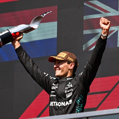 Jun 15, 2025; Montreal, Quebec, Canada; Winner of the F1 Canadian Grand Prix Mercedes driver George Russell (63) reacts after receiving his trophy at Circuit Gilles-Villeneuve. Mandatory Credit: David Kirouac-Imagn Images